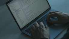 Hands at a computer
