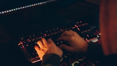 hands typing on keyboard