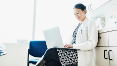 A doctor on their laptop