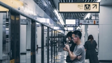 Passengers waiting in line in a subway in China