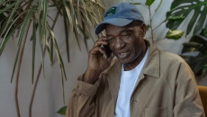 A senior patient talking on a cell phone