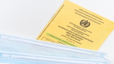 A photo of the WHO's yellow card or international certificate of vaccination