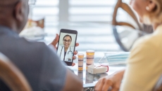 A doctor on a mobile phone