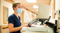 A nurse uses a computer