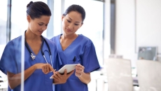Nurses using a tablet