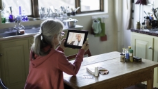Patient attending telehealth appointment via tablet