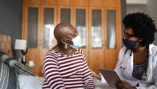 An older patient and a doctor