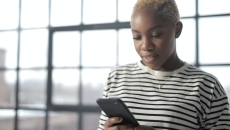 A person looking at their cell phone