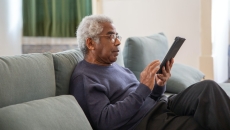 A patient holding a tablet