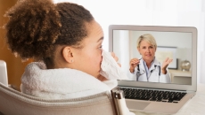 A patient using telehealth