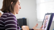A patient consults with a doctor using telehealth