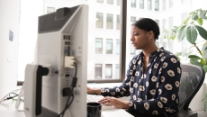 Woman at desktop computer