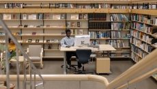 A person on the computer at the library