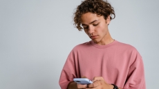 A person on their iPhone