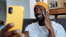 A person touching their face while on video chat