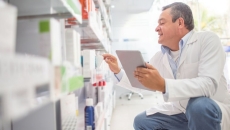 A pharmacist taking inventory
