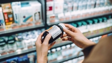 Person looking at pill bottle in Pharmacy