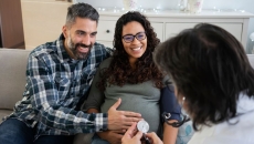 Doctor with pregnant couple