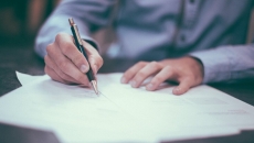 A person signing a document