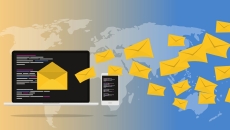 Email icons flying off a laptop