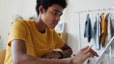 A teen using a computer
