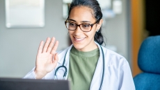 A medical professional starts a telehealth visit