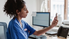 A provider speaking to a patient via telehealth