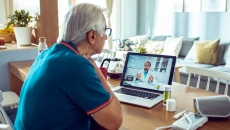 A patient consulting via telehealth
