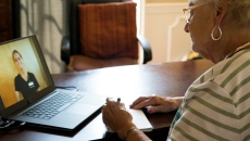 A patient speaking to a doctor on telehealth