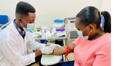 Urgent care clinician draws patient blood