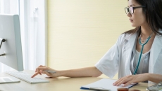 A doctor using a computer