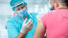 A person getting their COVID-19 vaccine shot