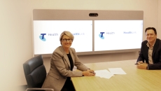 Telstra Health and HealthLink representatives following the signing of their sale deal