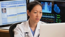 A doctor evaluating a patient's record