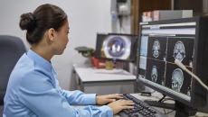 A radiologist examining X-ray images