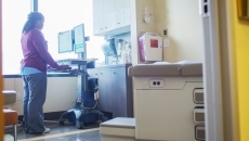 A nurse accessing records in a computer