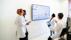 A team of medical scientists discussing among themselves