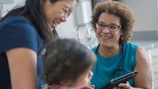 Doctor speaks with mother and child