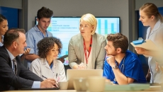 A group of hospital staff meets