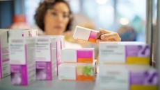 A pharmacist looking at medicine.