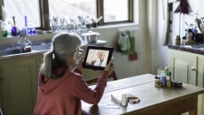 Patient attending telehalth appointment on tablet