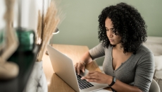 Person at desk on laptop