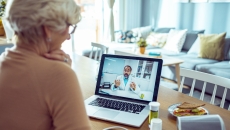 A patient speaks to their doctor on video chat