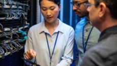 IT workers talking in a server room