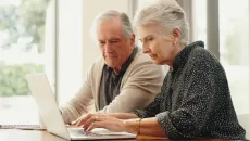 Couple using laptop