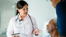 Doctor speaks to a patient in the hospital