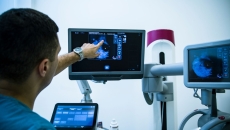 A doctor reviewing a mammogram