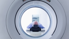 A patient undergoing CT scanning