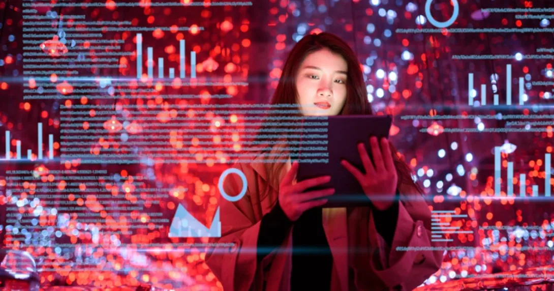 A person looks at a tablet, and red and blue pixelated data appears A person looks at a tablet, and red and blue pixelated data appears