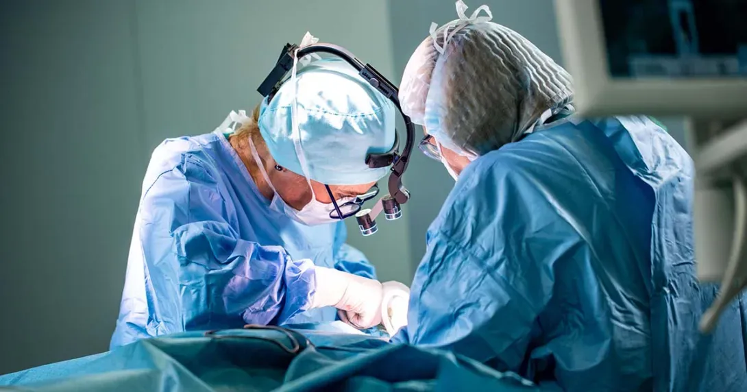 surgeons operating on a patient surgeons operating on a patient